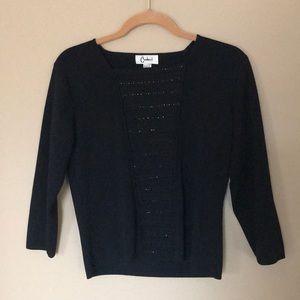 Black long sleeved shirt with beads.